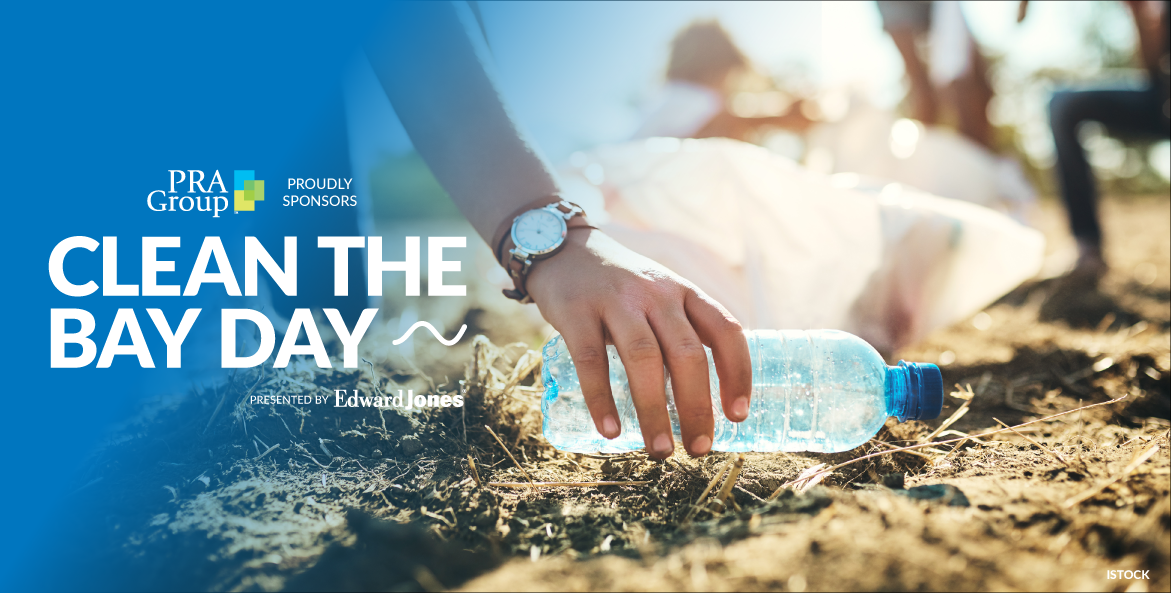 A hand reaches down to pick up an empty water bottle from the ground. Text reads PRA Group proudly sponsors Clean The Bay Day--presented by Edward Jones.