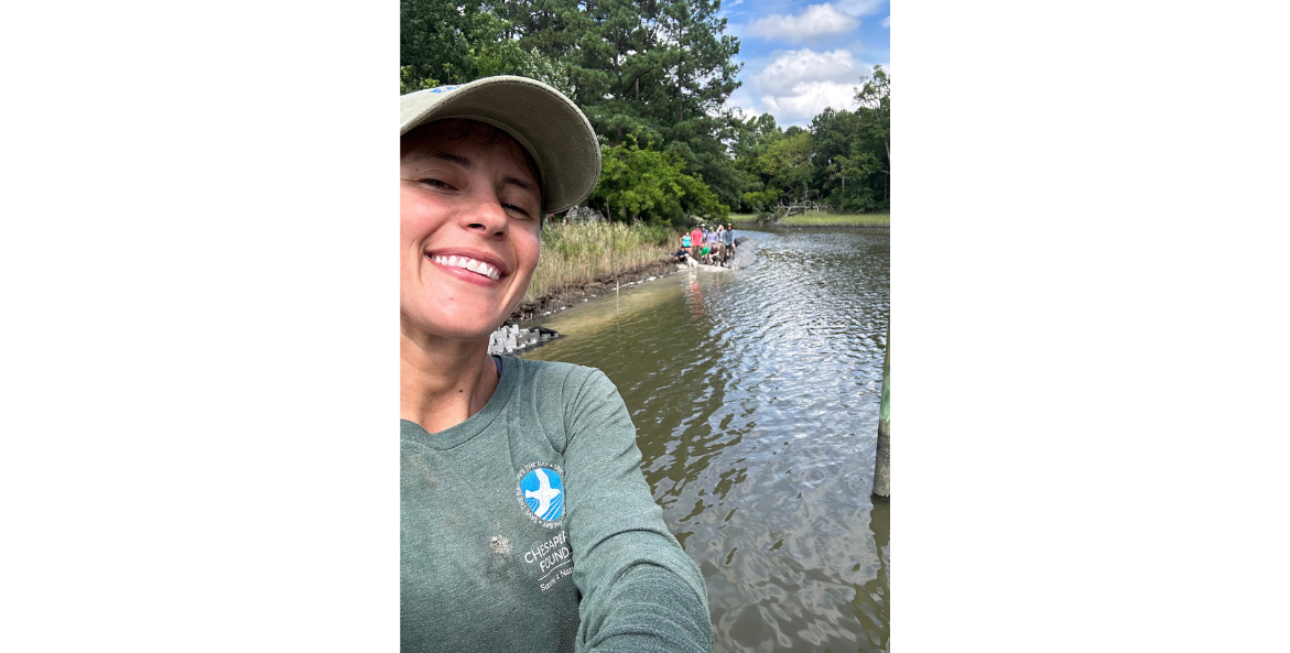 Kati Grigsby poses for a selfie with water in the background